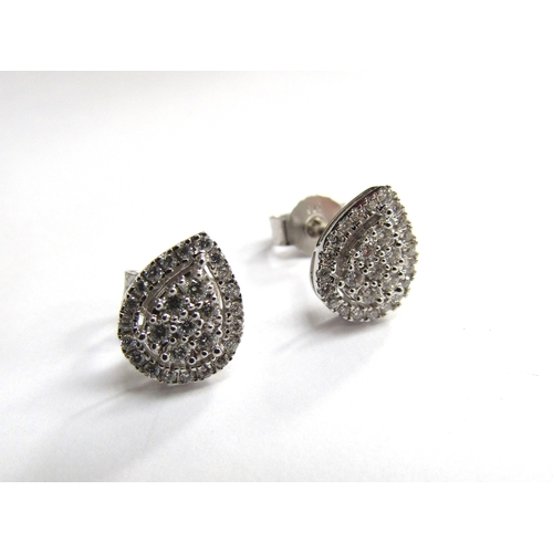 9452 - A pair of 9ct white gold pear shaped diamond cluster earrings, 1.7g                 (R) £180