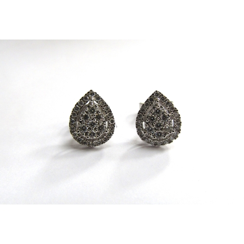 9452 - A pair of 9ct white gold pear shaped diamond cluster earrings, 1.7g                 (R) £180