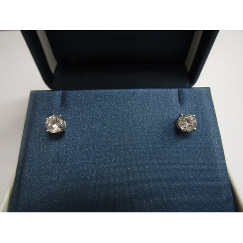 9451 - A pair of 9ct white gold cubic zirconia stud earrings, 1.5g       (R) £30