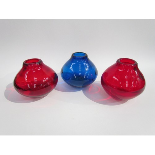 7204 - Three Whitefriars optic vases designed by Geoffrey Baxter, No.9586 in Ruby and Kingfisher Blue. 13.5... 