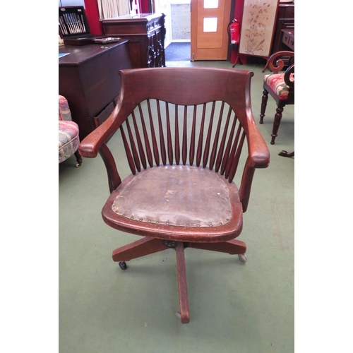 4103 - An early 20th Century spindle back office chair, tilt backrest, modern castors