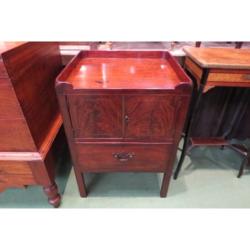 4199 - A George III mahogany nightstand, the two doors with line inlay decoration and single base drawer on... 