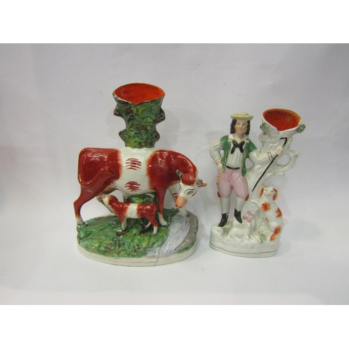 4243 - A Victorian Staffordshire cow group, 27cm tall, Victorian Staffordshire shepherd spill vase and Vict... 