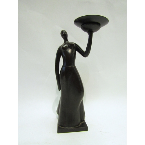 4245 - A metal candle stand in the form of a woman, 23cm tall   (R) £0  (E) £8-12