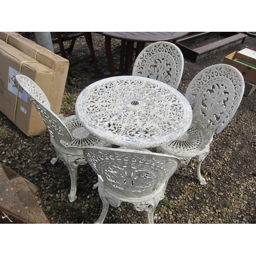 3608 - A cast alloy garden table with four chairs