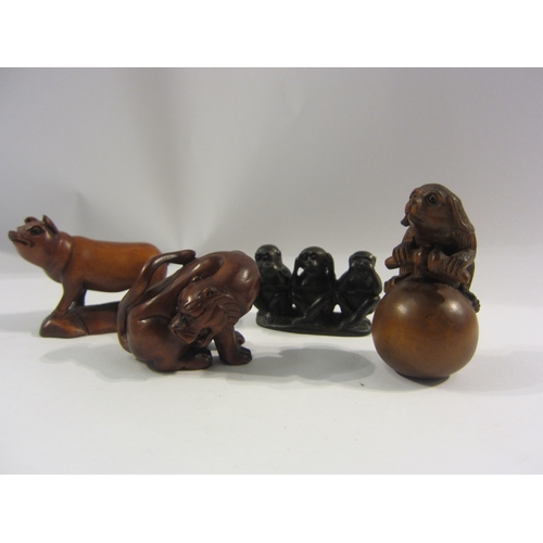 4326 - Four boxwood netsuke - pig, lion, monkeys, animal on gourd