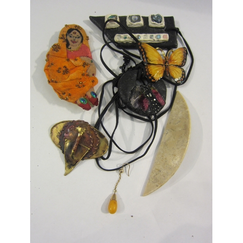 4328 - A bag containing mixed necklaces and brooches including Indian lady and butterfly examples