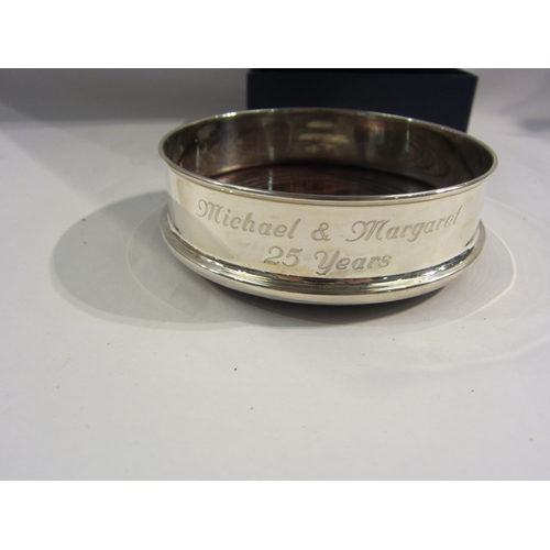 4340 - A Britannia 958 silver coaster with turned wood base, Sheffield 2004 Francis Howard Ltd., diameter a... 