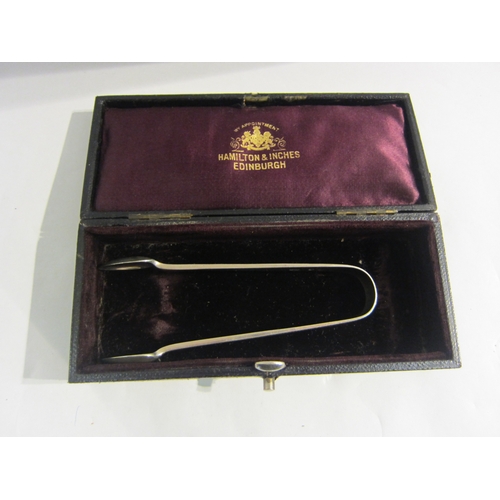 4341 - A pair of silver Hamilton & Inches sugar tongs in original case, Edinburgh 1902