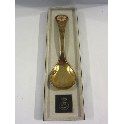 4342 - A silver gilt Georg Jensen year spoon (1976) with enamelled flower decoration   (R) £25