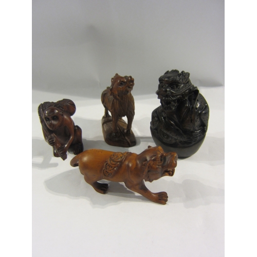 4352 - Four boxwood netsuke - monkey, goat, dragon, lion, all signed