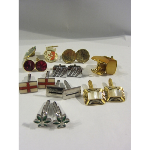 4356 - A box of costume gentleman's cuff links, tie pins and badges