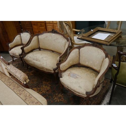 2433 - A late 19th Century Continental carved walnut framed three piece suite for re-upholstery