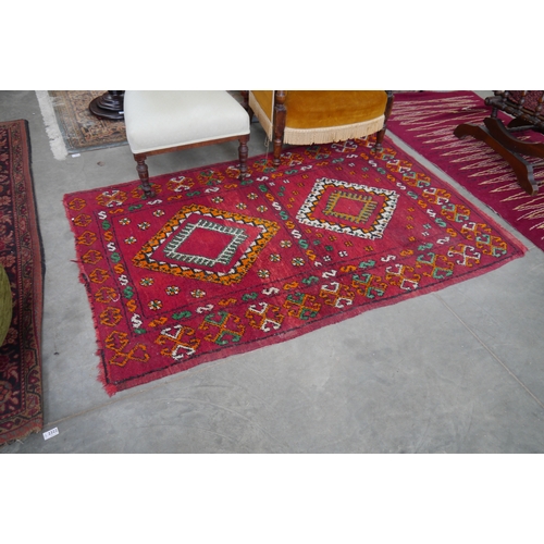 2422 - A red ground rug, 106 x 176cm and another   (R)  £30