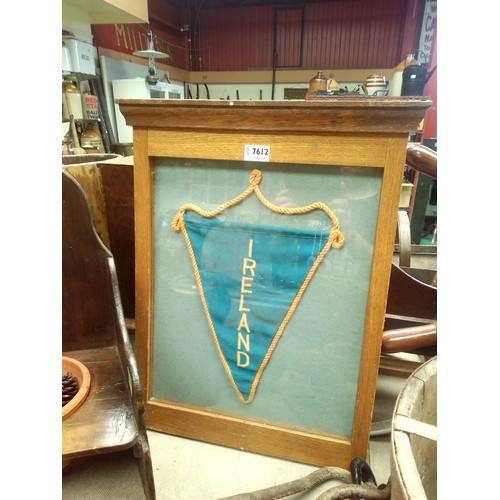 2133 - An oak framed and glazed mounted pennant 