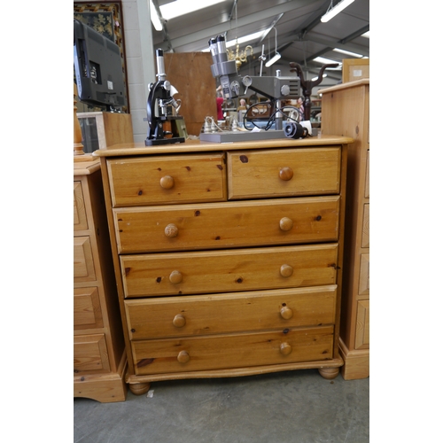 2527 - A modern pine chest of two short over four long drawers, together with mirror