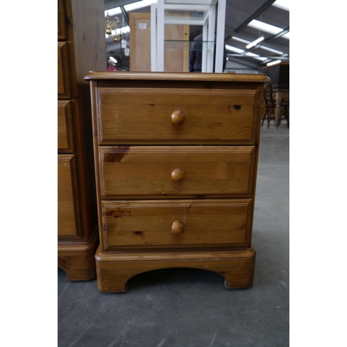 2361 - A pine Ducal two drawer bedside chest