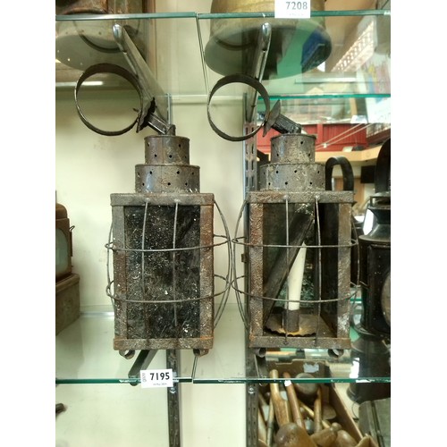 2337 - A pair of tin ware candle lanterns     (R)  £40