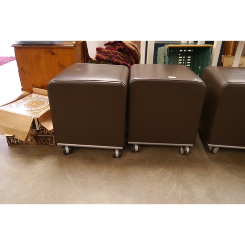 2518 - Four leather cube stools on castors by Allermuir