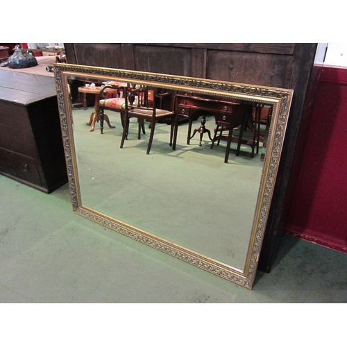 4020 - A large gilt rectangular bevel edge wall mirror, 103cm x 134cm total   (R) £35