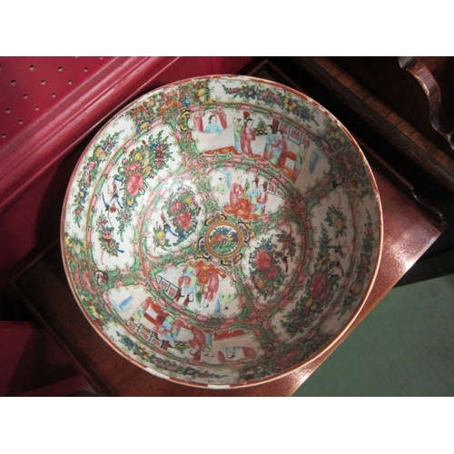 4041 - A large 19th Century Cantonese punch bowl, figural scenes, birds and flowers.  30cm diameter