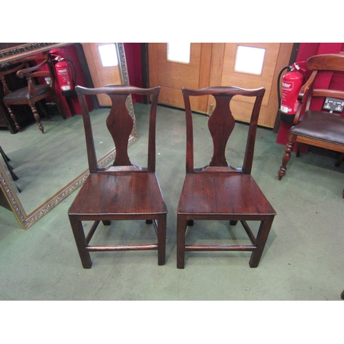 4062 - Circa 1820 a pair of East Anglian elm chairs with vase shape central splat back rest over a flat sea... 