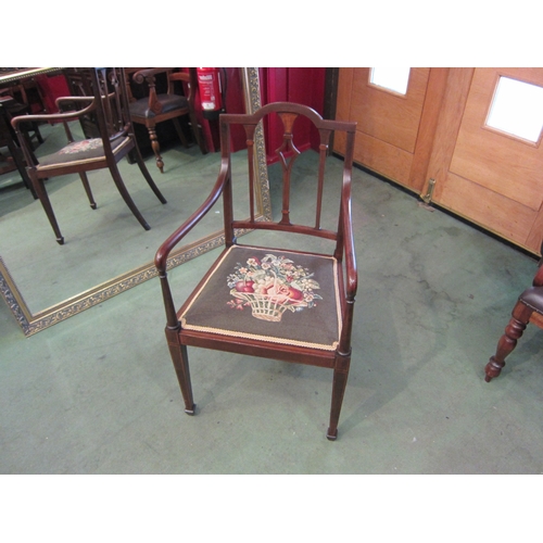 4071 - An Edwardian inlaid mahogany armchair with chequer strung decoration, the floral tapestry seat over ... 