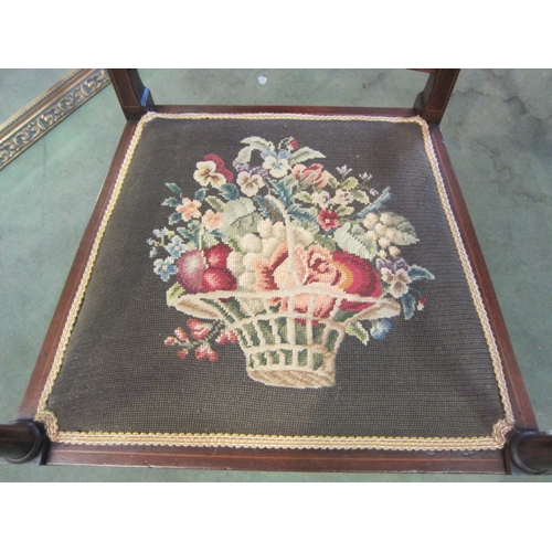 4071 - An Edwardian inlaid mahogany armchair with chequer strung decoration, the floral tapestry seat over ... 