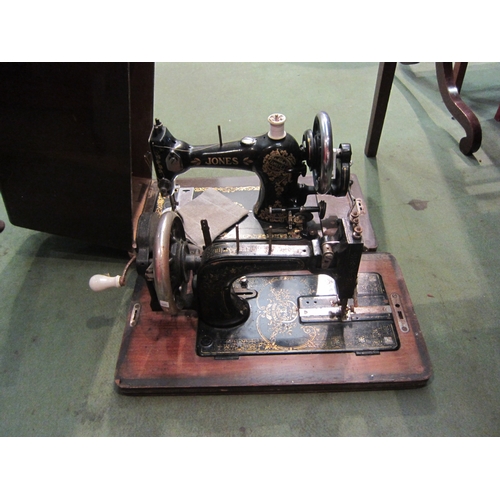 4080 - A Jones sewing machine B533148, cased, and a German example lacking lid