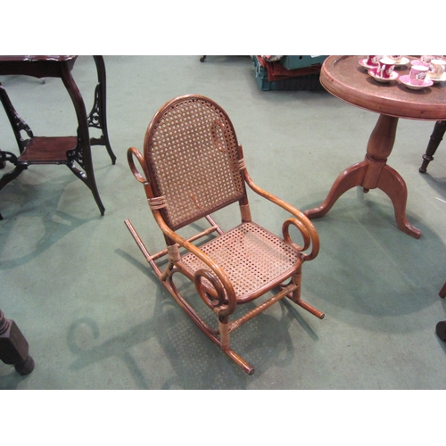 4090 - A child's bamboo rocking chair with cane seat and back rest   (R) £55