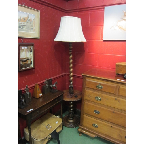 4123 - A mid-20th Century carved oak barley twist lamp stand with circular tray on a circular base    (R) £... 