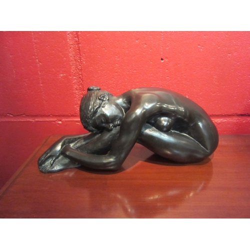 4125 - A resin bronze sculpture after Tom Greenshields, 'Chrissie Resting', 27cm long