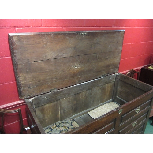 4133 - An 18th Century oak and elm country house mule chest with lift-top, faux drawer front with three low... 