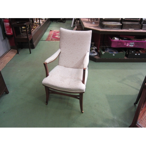 4160 - An Edwardian armchair, cream foliate design upholstery, on tapering legs to castors   (E) £20-30