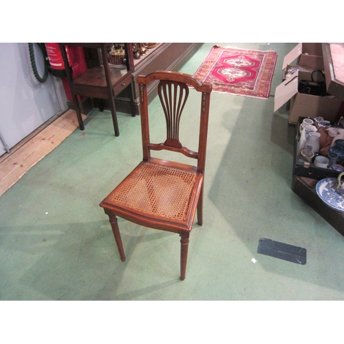 4161 - A French 19th Century walnut chair with ormolu mounts, the pierced central spat back rest over a can... 