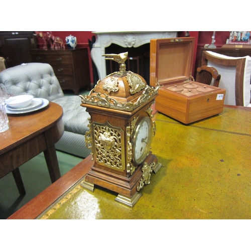 4177 - A mantel timepiece, mahogany case with brass ornamentation.  Enamel 3.5