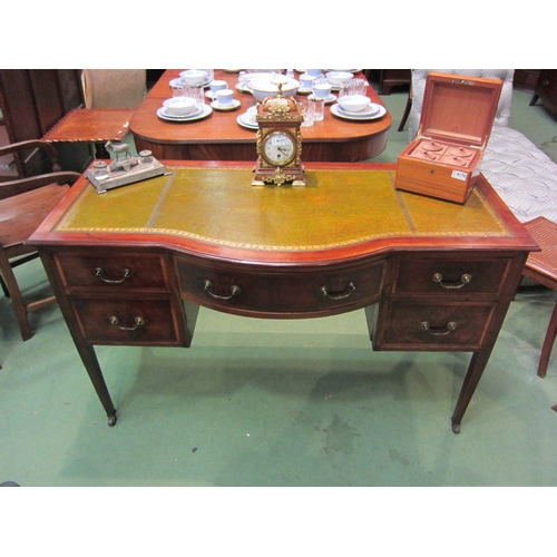 4179 - An Edwardian crossbanded mahogany breakfront desk the gilt tooled leather writing surface over a cen... 