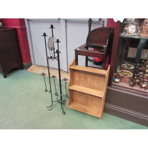 4184 - A pine wall shelf, three candle holders and a brass snuffer