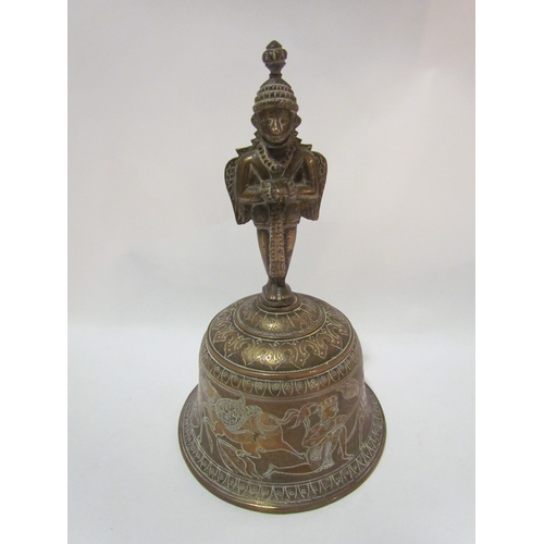 4279 - An Eastern brass bell with figural finial, animals and figural design, 21cm tall