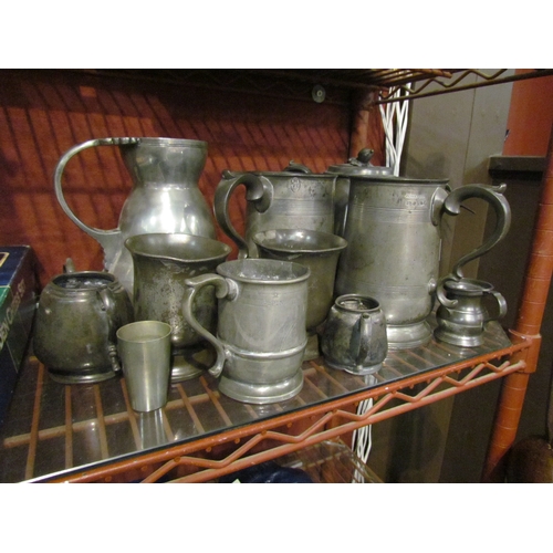 4282 - A quantity of mostly antique pewter including Victorian quart tankards, measures, jug etc.