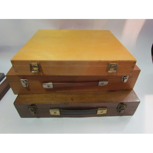 4296 - Three empty wooden paint boxes together with a cased A.West & Partners compass etc.