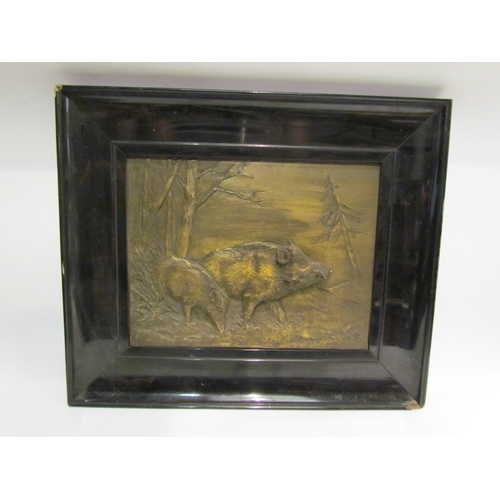 4360 - Three gilt metal wall reliefs of lions and wild boar, various sizes, ebonised lacquered frames