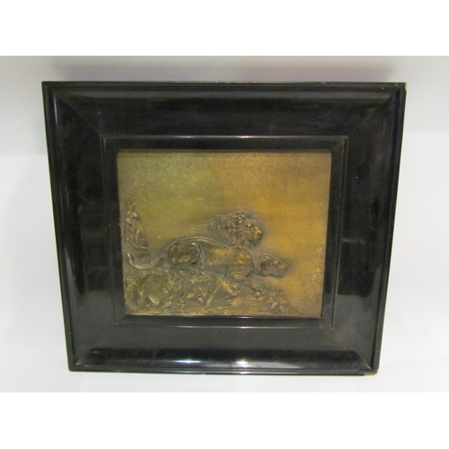 4360 - Three gilt metal wall reliefs of lions and wild boar, various sizes, ebonised lacquered frames