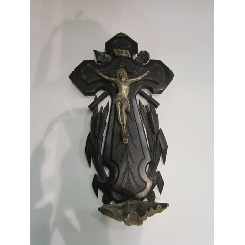 4368 - An early 20th Century ebonised crucifix with Holy water bowl, 32cm long