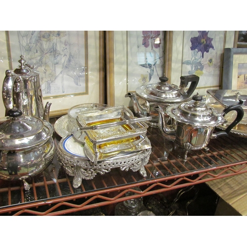 4398 - A collection of silver plated wares including teapots, dish, etc.