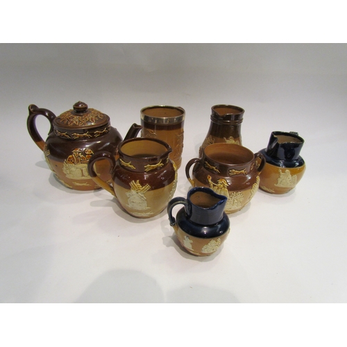 4410 - Seven Royal Doulton harvest ware pieces including teapot, jugs, tankard with silver rim etc.