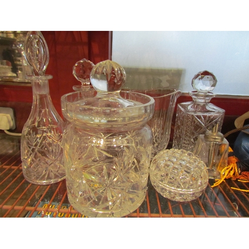 4419 - Three cut glass decanters, a jug, ice bucket etc. (7)