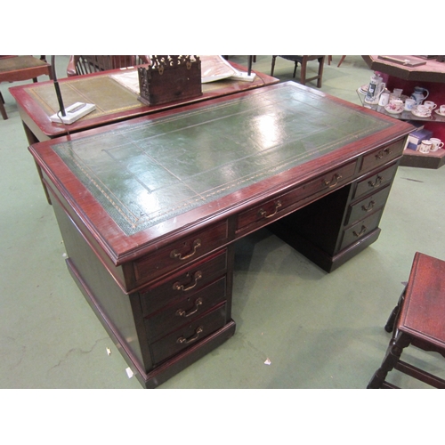 4109 - A George III revival mahogany twin pedestal desk the gilt tooled leather writing surface over nine d... 