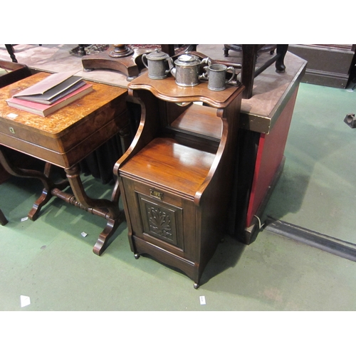 4192 - A Circa 1900 carved walnut coal purdonium, the raised mirror back and shelf over a brushing slide, t... 