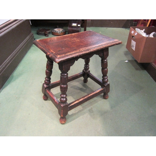 4220 - A Jacobean style oak joined stool with turned supports joined by a stretcher, 46cm tall x 46cm long ... 